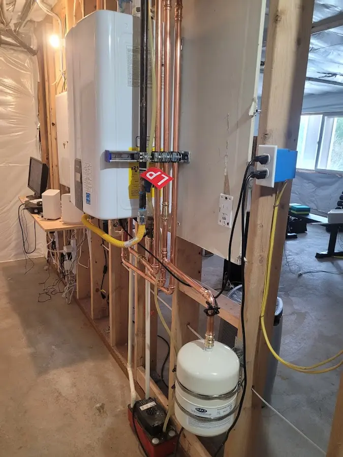 Licensed plumber repairing a kitchen sink in Pana